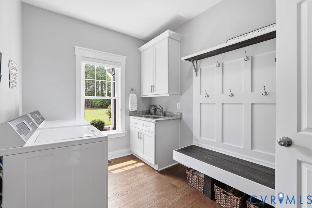 13114 Spring Road, Barr Brook Farms, Rockville, VA 23146 Wood-finish flooring, built-in mudroom bench with coat hooks, white cabinetry, integrated utility sink, and a framed window