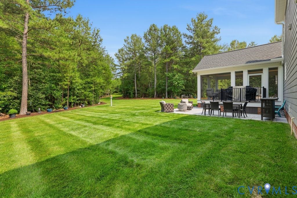 13114 Spring Road, Barr Brook Farms, Rockville, VA 23146 Expansive green lawn bordered by mature trees, featuring a screened porch and a stone patio