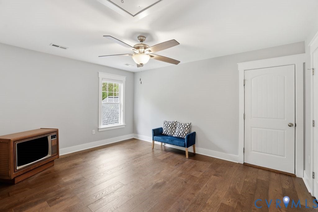 13114 Spring Road, Barr Brook Farms, Rockville, VA 23146 Wood-finish flooring, white trim, ceiling fan with integrated lighting, and multiple windows