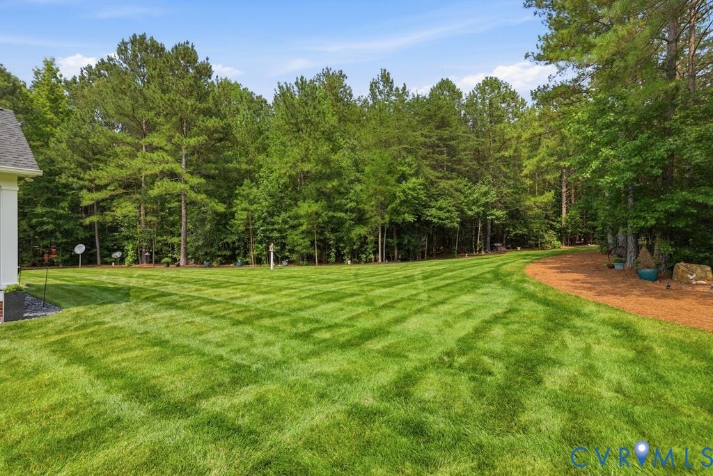 13114 Spring Road, Barr Brook Farms, Rockville, VA 23146 Expansive green lawn extending to a natural tree line, featuring a defined mulch border