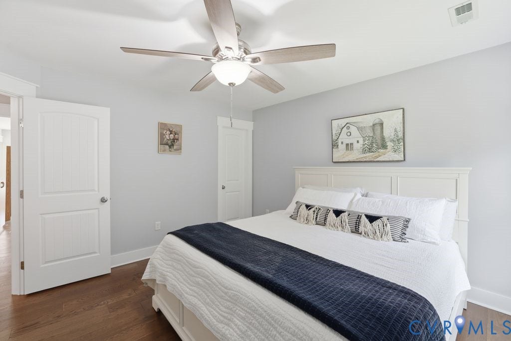 13114 Spring Road, Barr Brook Farms, Rockville, VA 23146 Hardwood-finish flooring, ceiling fan with integrated lighting, two-panel interior doors, and a paneled headboard