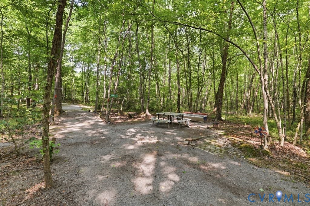 13114 Spring Road, Barr Brook Farms, Rockville, VA 23146 Gravel path through a wooded area featuring mature trees and a shaded picnic area