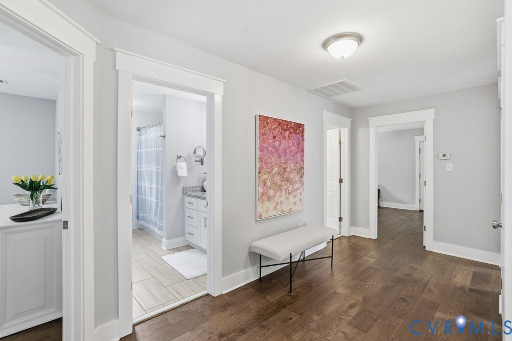 13114 Spring Road, Barr Brook Farms, Rockville, VA 23146 Hardwood flooring, light gray walls, white trim, recessed lighting, and a bathroom with a white vanity and tiled flooring