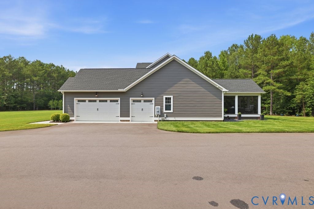 13114 Spring Road, Barr Brook Farms, Rockville, VA 23146 Two-car garage with white paneled doors, gray siding exterior, and a screened-in porch