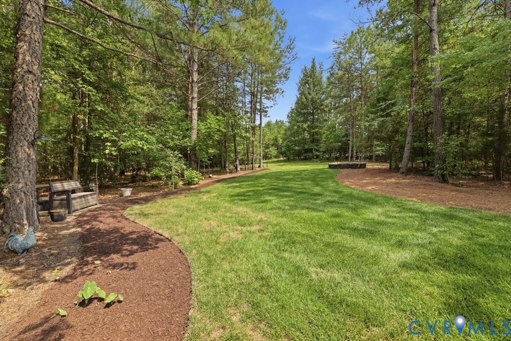 13114 Spring Road, Barr Brook Farms, Rockville, VA 23146 Expansive lawn bordered by mature trees and a mulched pathway
