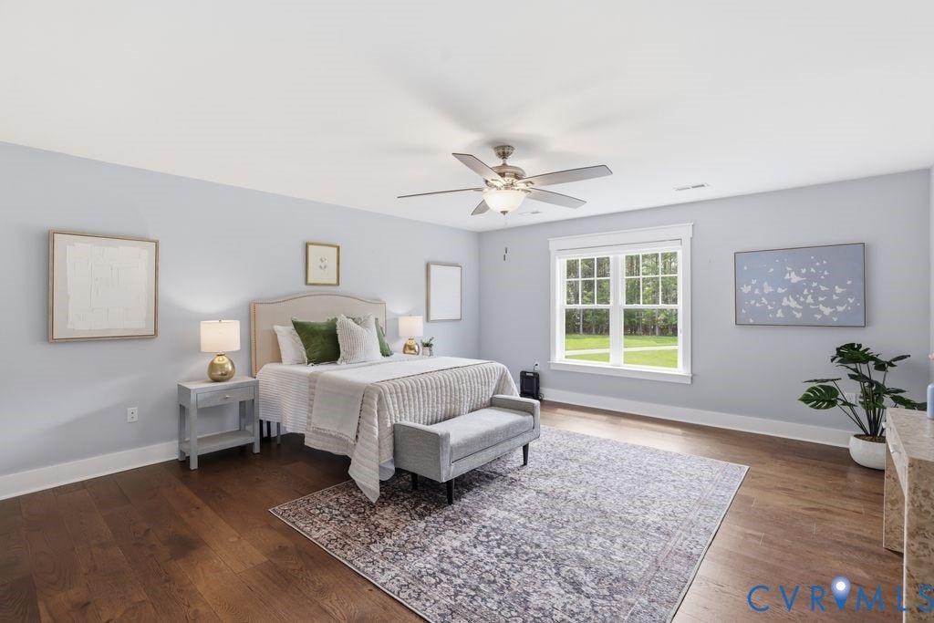 13114 Spring Road, Barr Brook Farms, Rockville, VA 23146 Spacious room with wood-finish flooring, light blue walls, and a large window with white trim