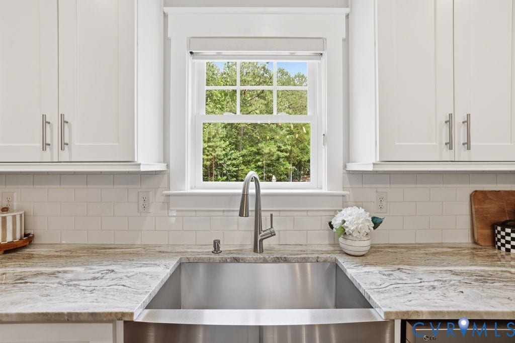 13114 Spring Road, Barr Brook Farms, Rockville, VA 23146 White shaker-style cabinetry, subway tile backsplash, stainless steel farmhouse sink, contemporary pull-down faucet, and light-toned countertops