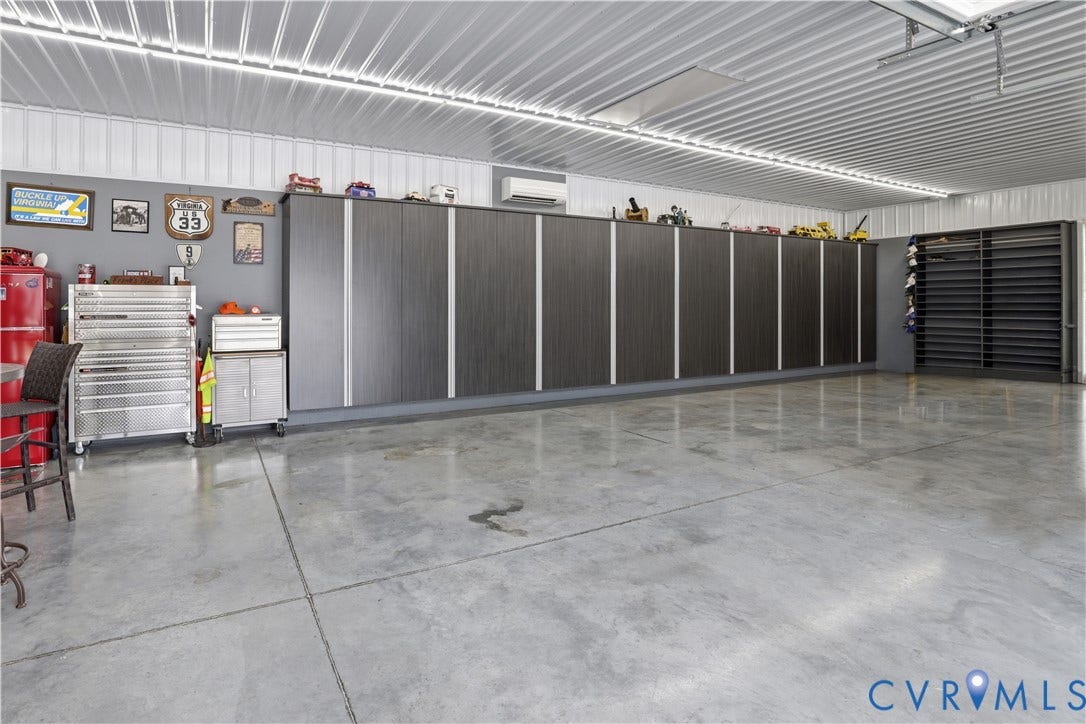 13114 Spring Road, Barr Brook Farms, Rockville, VA 23146 Concrete flooring with expansion joints, extensive built-in cabinetry, metal ceiling panels, and integrated overhead lighting