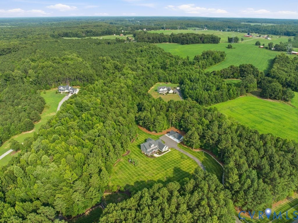 13114 Spring Road, Barr Brook Farms, Rockville, VA 23146 Expansive property featuring a large residence, detached two-car garage, extensive manicured lawn, and surrounding mature trees