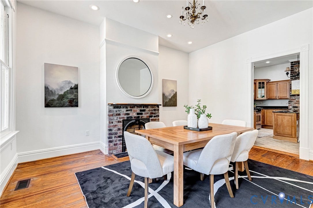615 N 23rd Street, Church Hill Central, Richmond, VA 23223 Hardwood flooring, brick fireplace, recessed lighting, crown molding, and a decorative chandelier