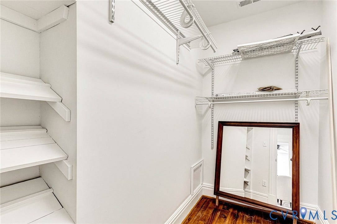615 N 23rd Street, Church Hill Central, Richmond, VA 23223 Built-in shelving, wire rack shelving system, rich wood-finish flooring, and white painted walls