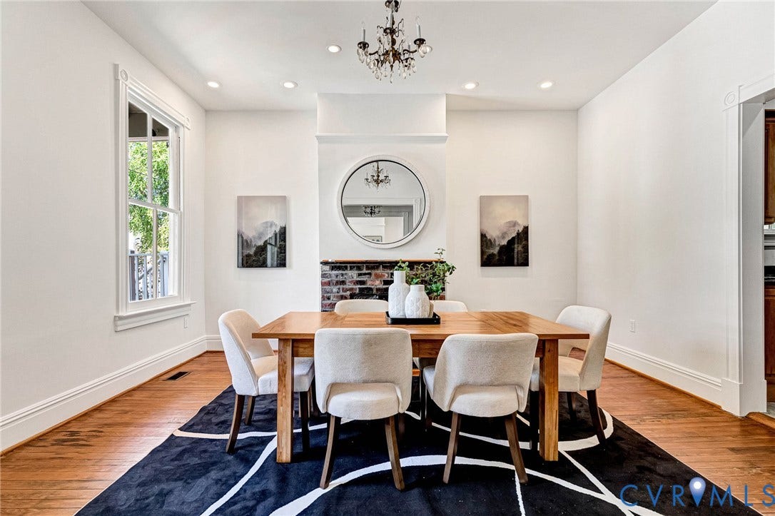 615 N 23rd Street, Church Hill Central, Richmond, VA 23223 Wood-finish flooring, recessed lighting, and a chandelier illuminate this space