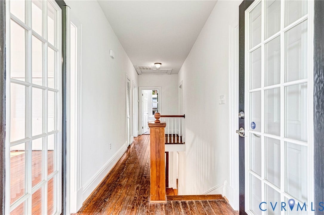615 N 23rd Street, Church Hill Central, Richmond, VA 23223 Hallway featuring wood-finish flooring, white walls, and French doors