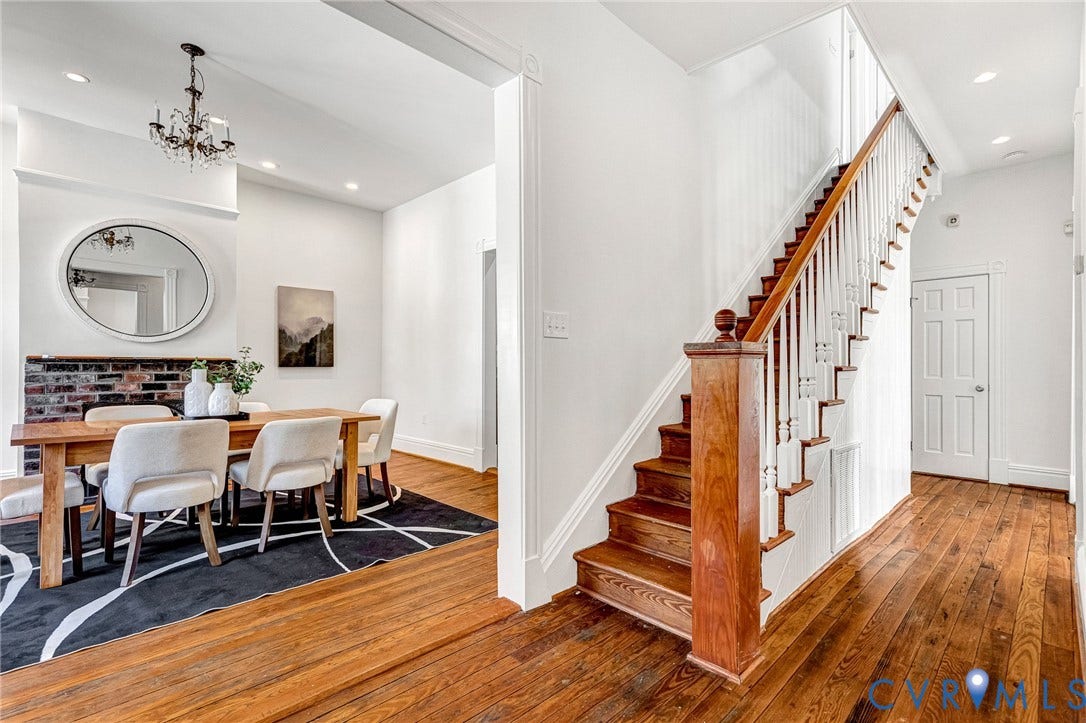 615 N 23rd Street, Church Hill Central, Richmond, VA 23223 Wood-finish flooring throughout, with a classic staircase featuring a wood newel post and white balusters