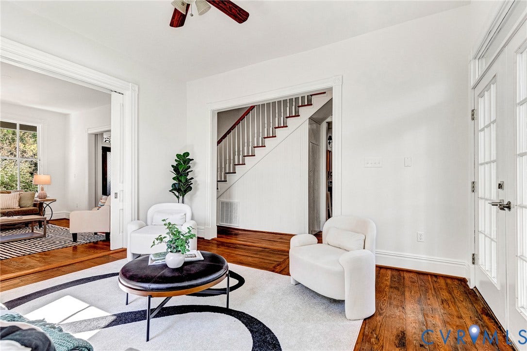 615 N 23rd Street, Church Hill Central, Richmond, VA 23223 Rich wood-finish flooring throughout, white painted trim, white painted walls, ceiling fan with brown wood-finish blades, and double glass-paneled doors