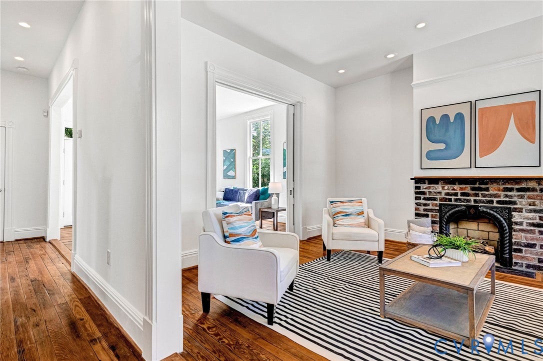 615 N 23rd Street, Church Hill Central, Richmond, VA 23223 Hardwood flooring throughout, recessed lighting, and a brick fireplace with an ornate iron insert