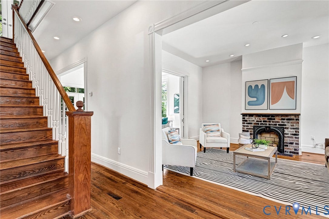 615 N 23rd Street, Church Hill Central, Richmond, VA 23223 Wood-finish flooring throughout, featuring a traditional staircase with white balusters