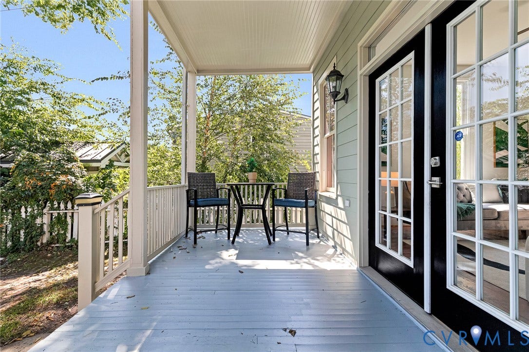 615 N 23rd Street, Church Hill Central, Richmond, VA 23223 Covered porch with light blue flooring, white railing, and exterior wall sconce
