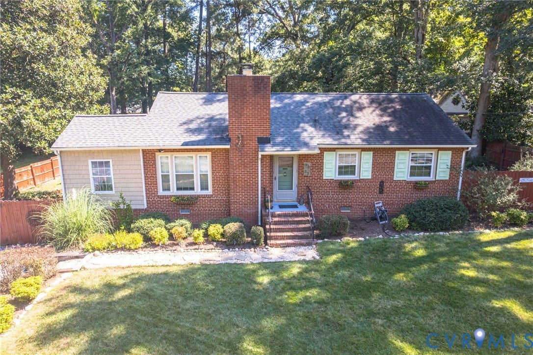 3353 Warner Road, Stratford Hills, Richmond, VA 23225 Brick exterior with a prominent brick chimney, light-colored roofing, and a front entry porch with steps