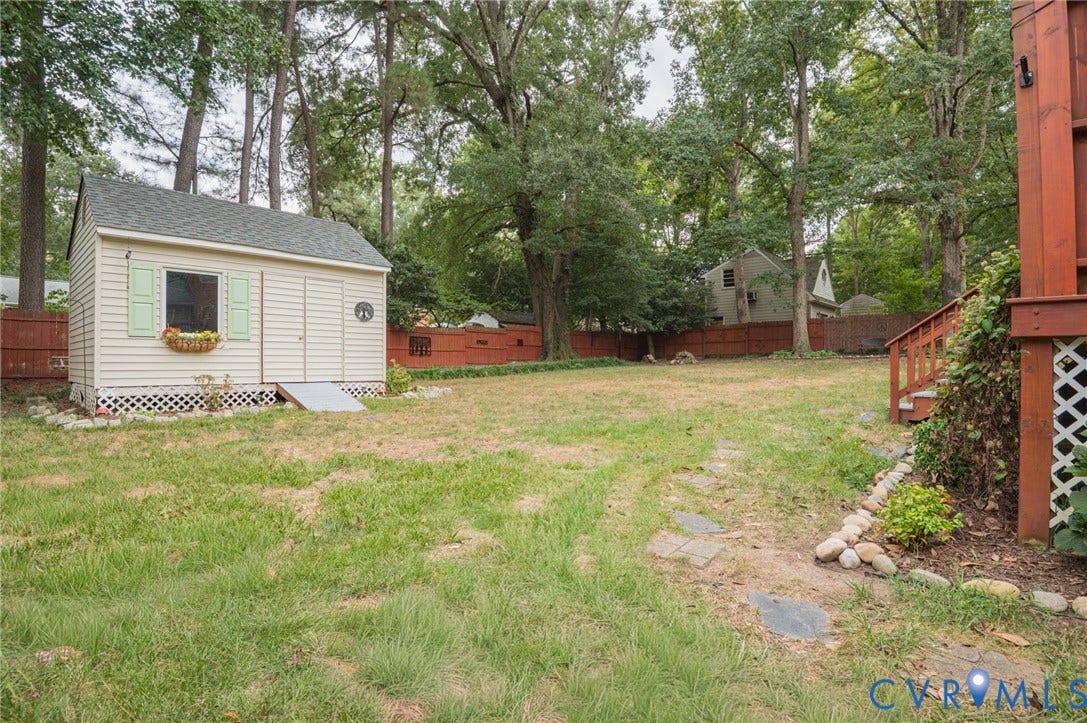 3353 Warner Road, Stratford Hills, Richmond, VA 23225 Expansive backyard with a storage shed, wood deck and stairs, and mature trees