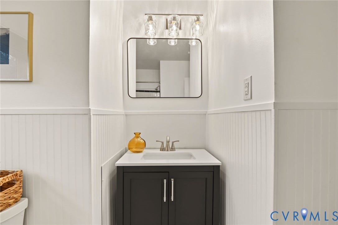 3353 Warner Road, Stratford Hills, Richmond, VA 23225 Vanity with white countertop, undermount sink, and brushed nickel faucet
