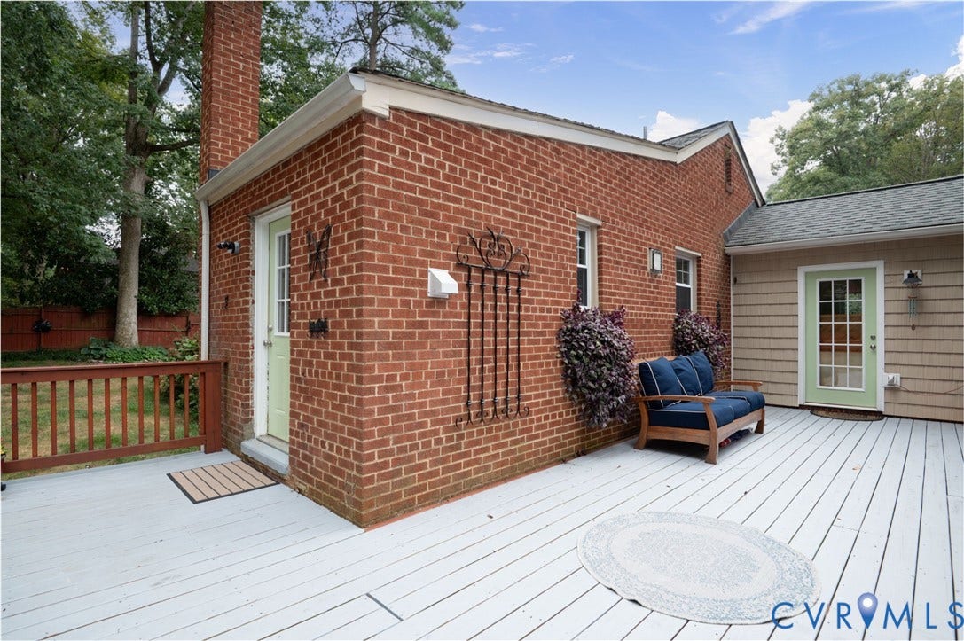 3353 Warner Road, Stratford Hills, Richmond, VA 23225 Spacious multi-level deck with white painted decking, brick exterior, and a light green French door