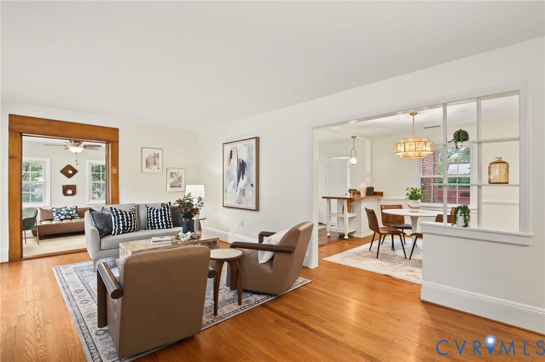 3353 Warner Road, Stratford Hills, Richmond, VA 23225 Hardwood flooring throughout, a wide cased opening with wood trim, and a partial wall with window-pane detailing