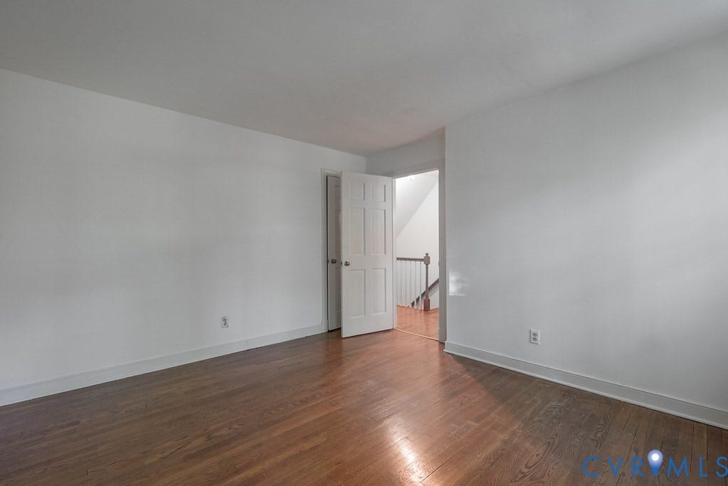 13830 Hailsham Circle, Salisbury, Midlothian, VA 23113 Hardwood flooring, white walls, and a white interior door