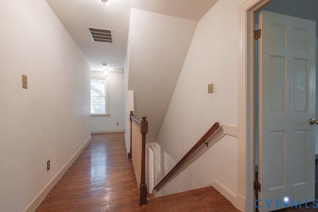 13830 Hailsham Circle, Salisbury, Midlothian, VA 23113 Hardwood flooring, painted interior door, window with natural light, painted walls, and wood banister