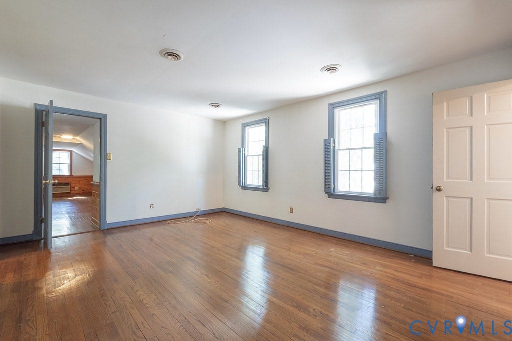 13830 Hailsham Circle, Salisbury, Midlothian, VA 23113 Hardwood flooring, two sash windows with interior shutters, paneled door, and recessed lighting