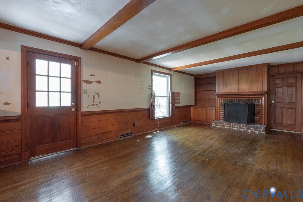 13830 Hailsham Circle, Salisbury, Midlothian, VA 23113 Exposed wood beams, wood-finish flooring, brick fireplace with mantel, built-in shelving, and wainscoting