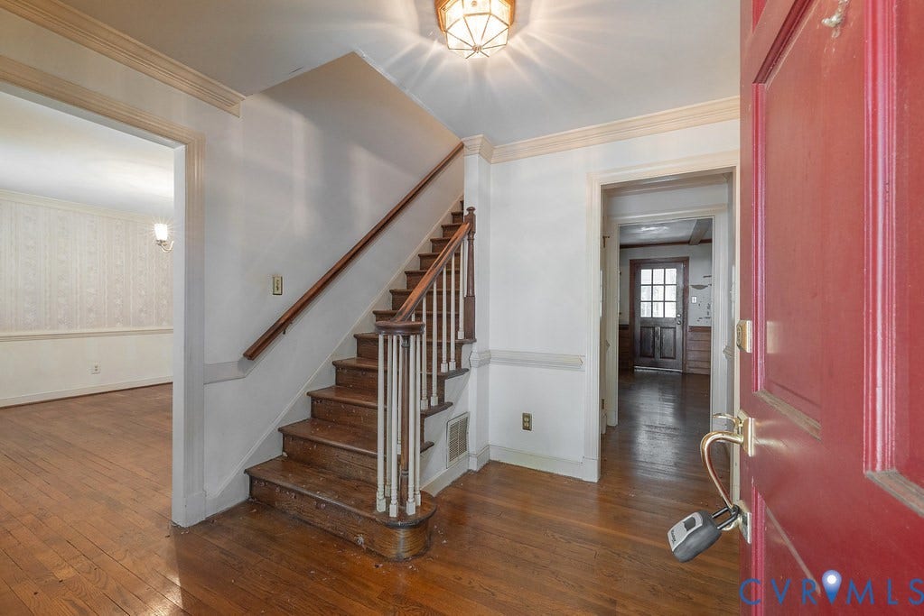 13830 Hailsham Circle, Salisbury, Midlothian, VA 23113 Hardwood flooring, central staircase with wood banister, decorative ceiling light fixture, and crown molding