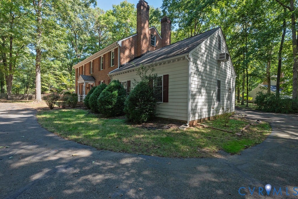 13830 Hailsham Circle, Salisbury, Midlothian, VA 23113 Red brick facade with a white columned portico entry