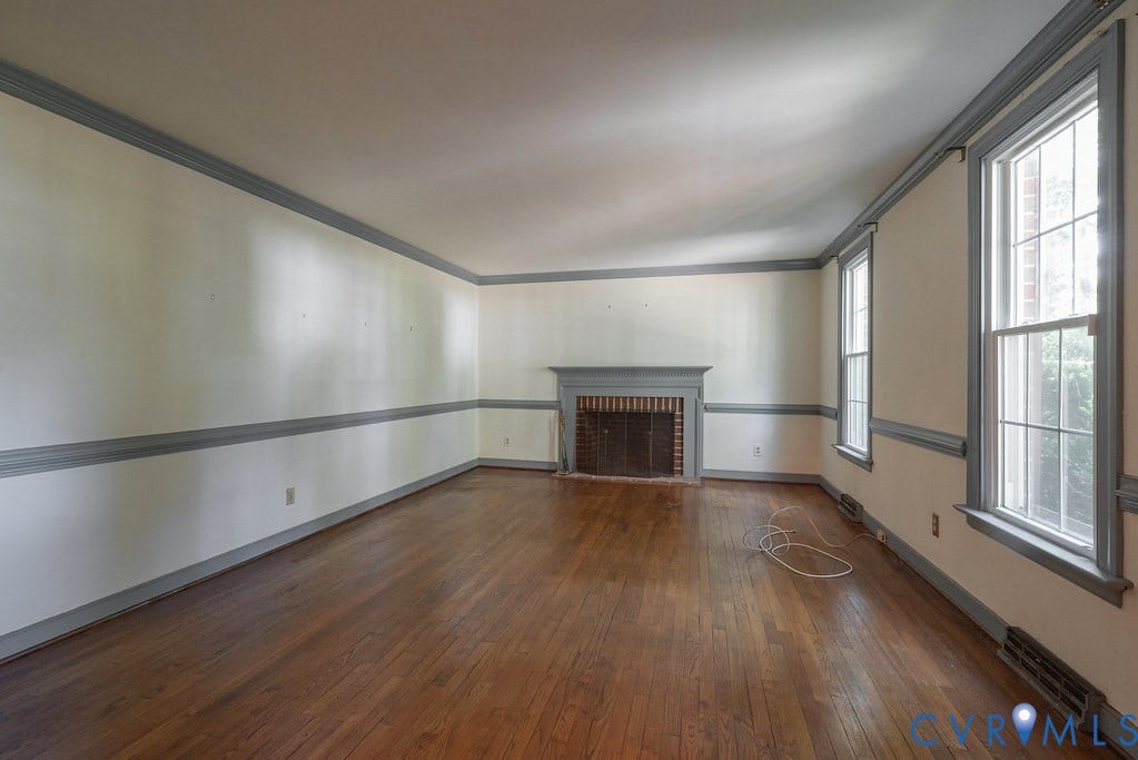 13830 Hailsham Circle, Salisbury, Midlothian, VA 23113 Hardwood flooring, decorative crown molding, chair rail molding, brick fireplace with a painted mantel, and multiple windows
