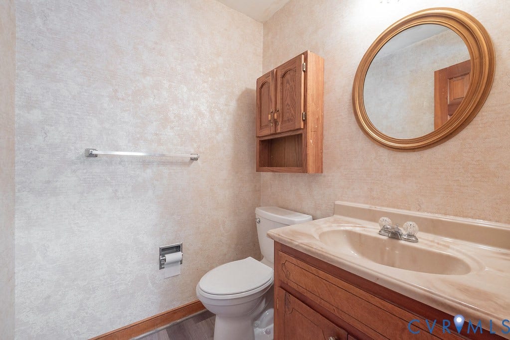 13830 Hailsham Circle, Salisbury, Midlothian, VA 23113 Wood-finish vanity with an integrated sink and countertop