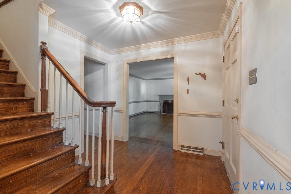 13830 Hailsham Circle, Salisbury, Midlothian, VA 23113 Hardwood flooring, wood staircase with white balusters, crown molding, and wainscoting