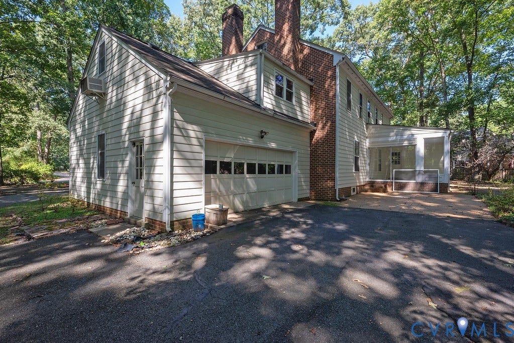 13830 Hailsham Circle, Salisbury, Midlothian, VA 23113 Asphalt driveway leading to an attached garage with a paneled door