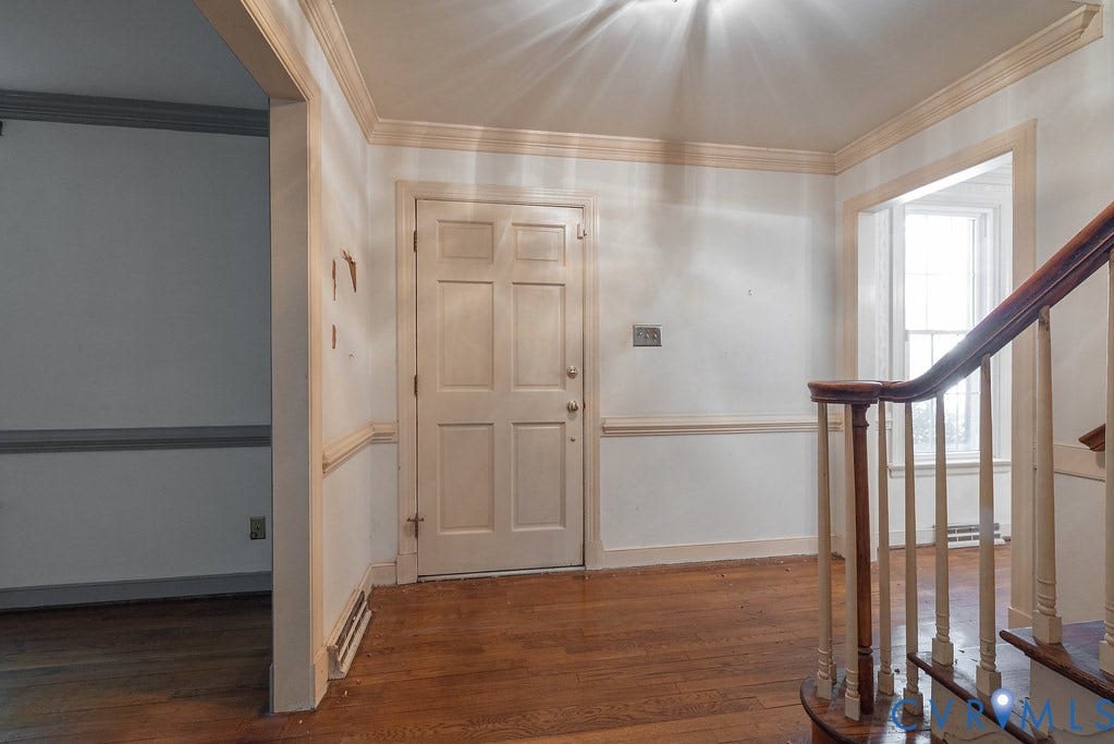 13830 Hailsham Circle, Salisbury, Midlothian, VA 23113 Hardwood flooring throughout, detailed crown molding, wainscoting, and a multi-panel interior door