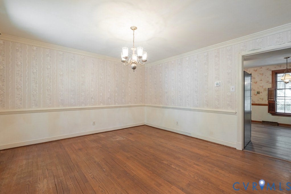 13830 Hailsham Circle, Salisbury, Midlothian, VA 23113 Hardwood flooring, decorative wallpaper, crown molding, chair rail molding, and a chandelier