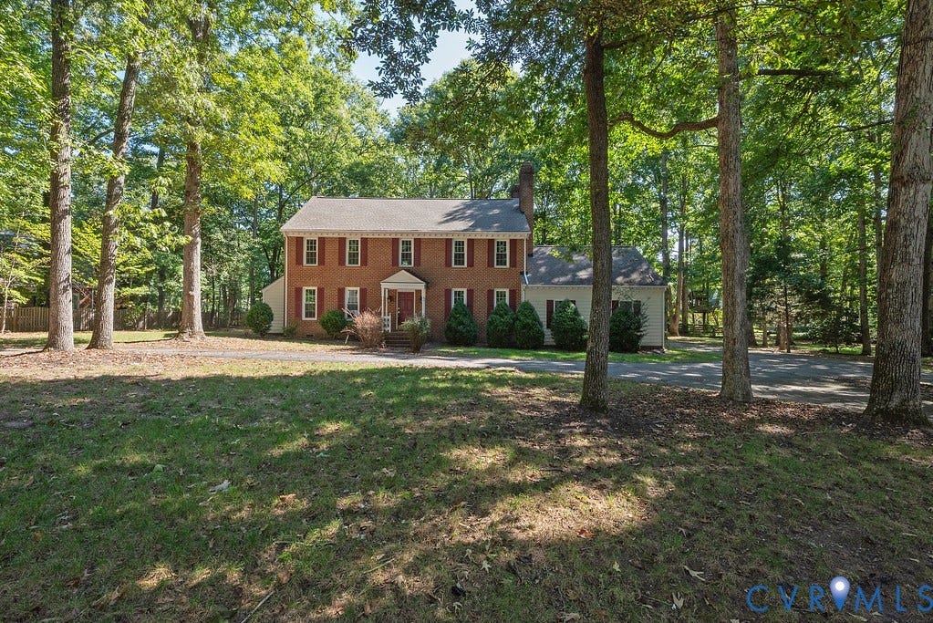 13830 Hailsham Circle, Salisbury, Midlothian, VA 23113 Brick colonial residence featuring red shutters, a columned portico, and mature trees