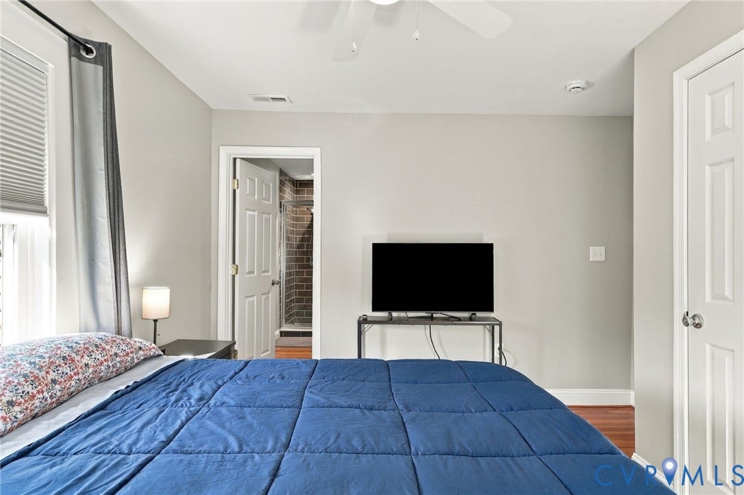3504 Delaware Avenue, Richmond, VA 23222 Hardwood-finish flooring, white paneled doors, and a ceiling fan