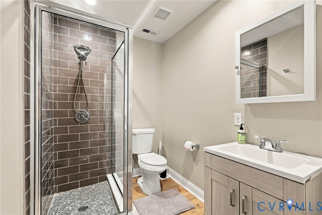 3504 Delaware Avenue, Richmond, VA 23222 Glass-enclosed shower with subway tile surround and mosaic floor