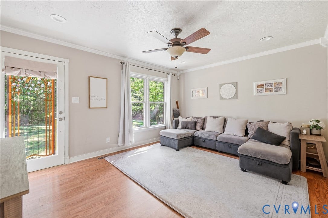 Wood-finish flooring, recessed lighting, and a ceiling fan with light fixture