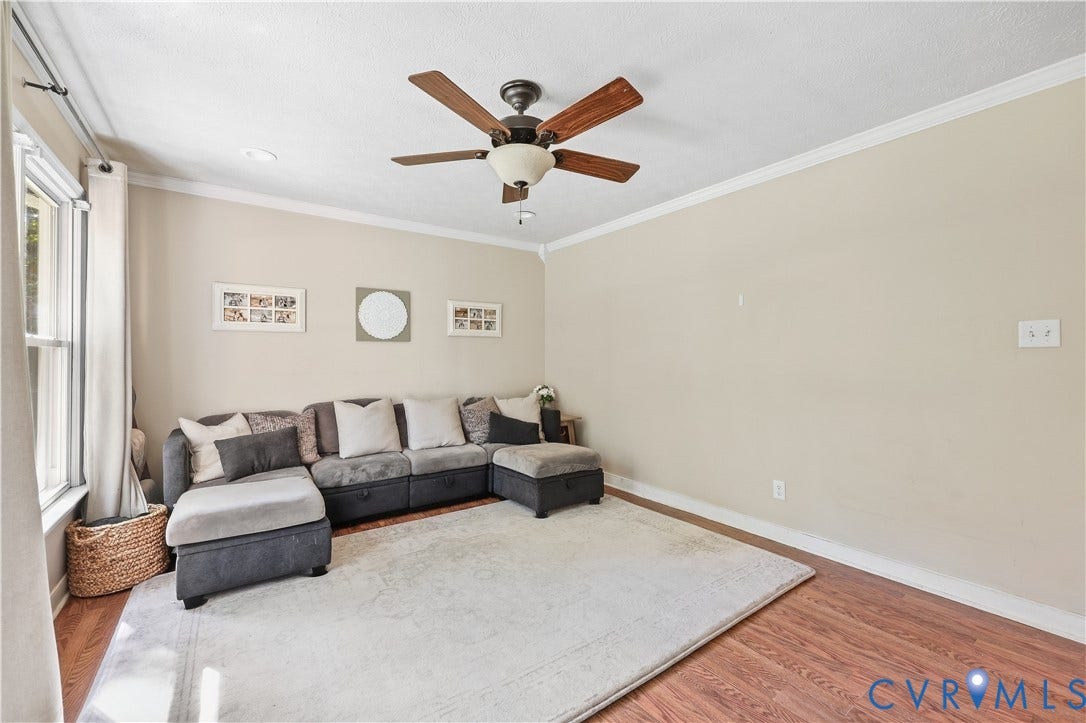 Recessed lighting, crown molding, wood-finish flooring, and a ceiling fan with integrated lighting