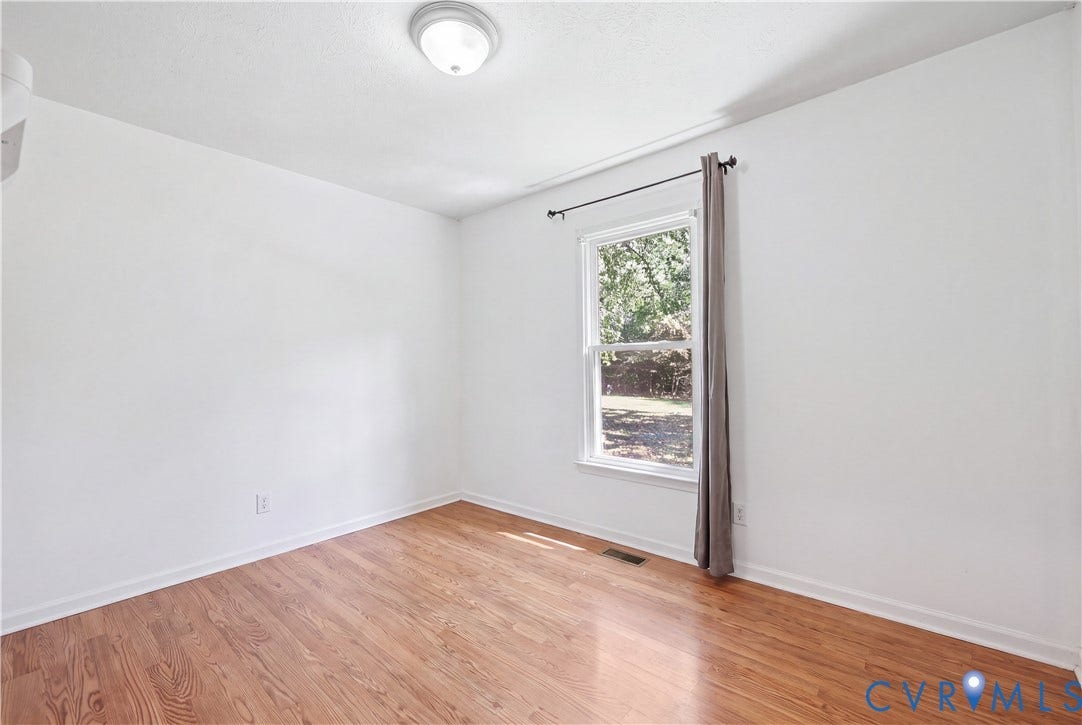 Hardwood-finish flooring, recessed ceiling light, and window with natural light