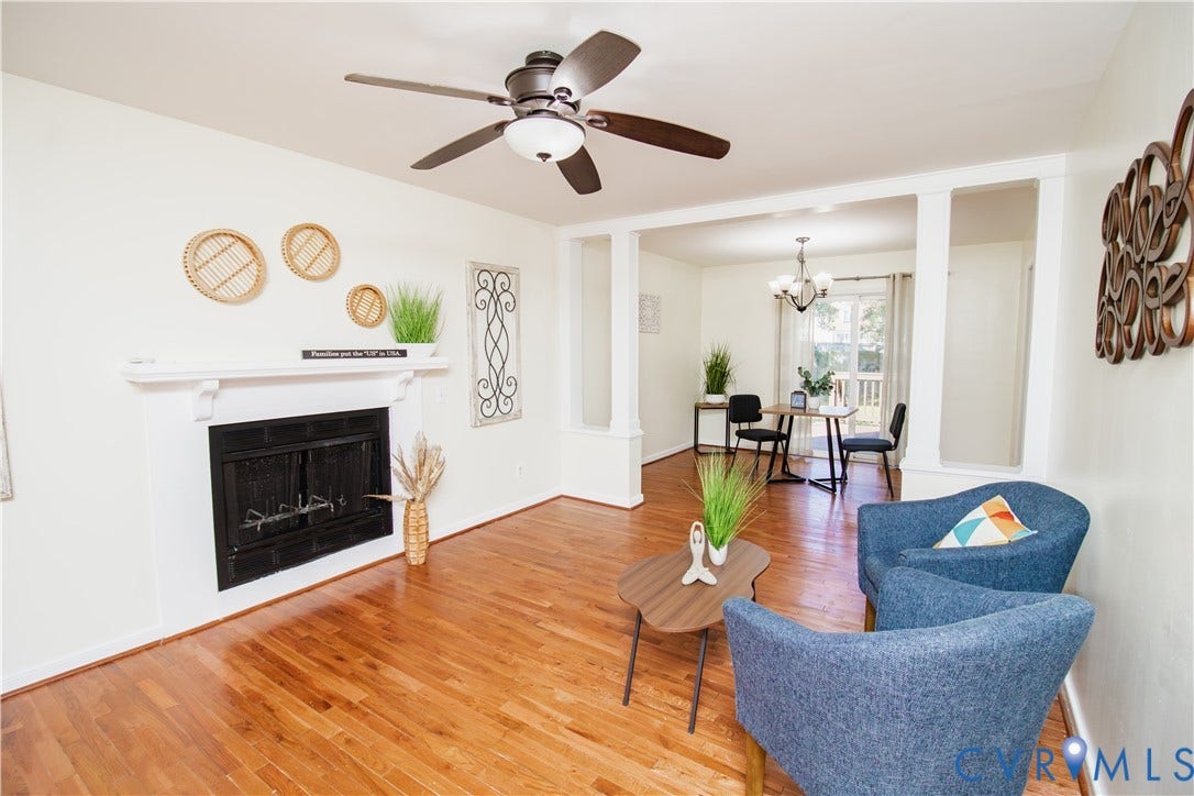 1307 Berrymeade Avenue, Henrico, VA 23060 Hardwood flooring throughout, white mantel fireplace, ceiling fan with integrated lighting, and a defined entry to an additional space