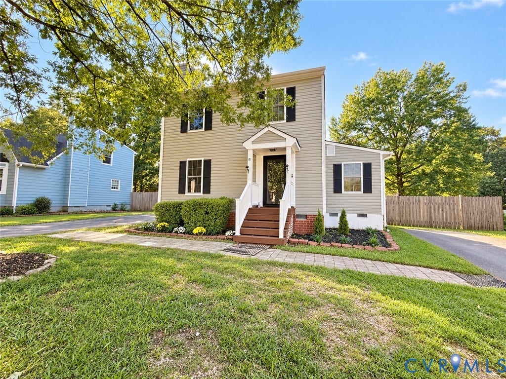 1307 Berrymeade Avenue, Henrico, VA 23060 Two-story residence featuring light-colored siding, black shutters, and an inviting front porch with dark wood stairs