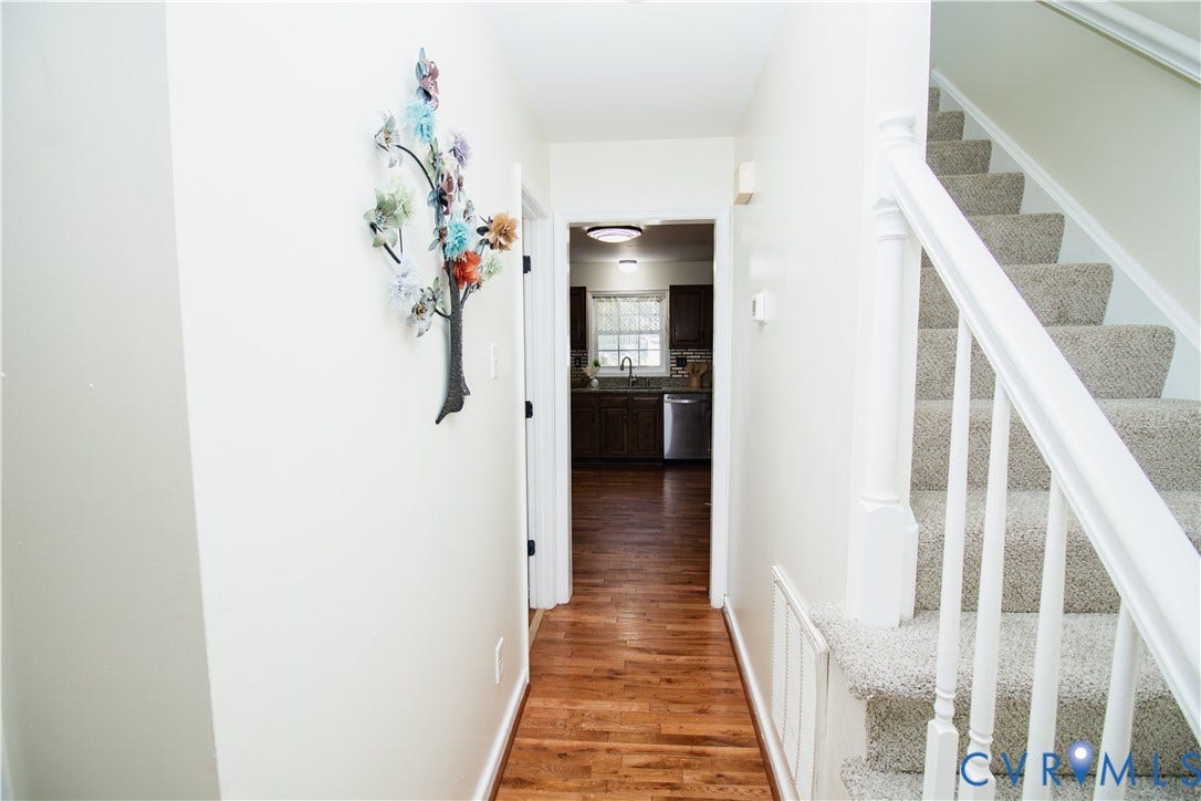 1307 Berrymeade Avenue, Henrico, VA 23060 Staircase with carpeted treads and white wood-finish balusters