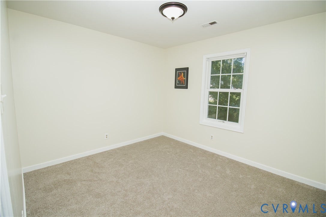 1307 Berrymeade Avenue, Henrico, VA 23060 Light-colored carpeting with white baseboards and a ceiling-mounted light fixture