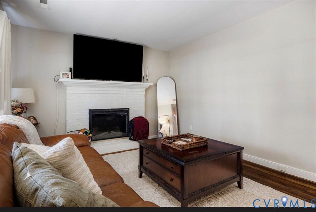 Painted brick fireplace with a detailed mantel